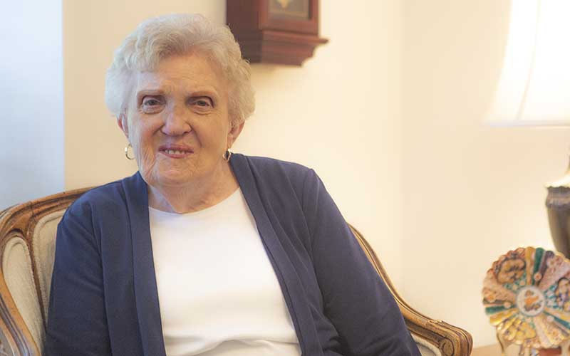 June Leifson seated in her living room.