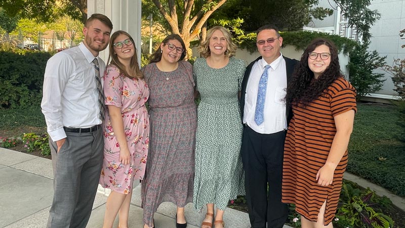 Kira Evans, third from the left, posing with a group of people