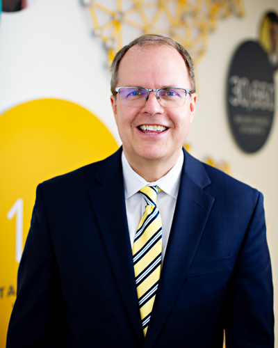 Man wearing a suit and tie.