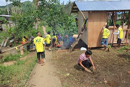 Helping Hands volunteers build a new house in the Philippines. 