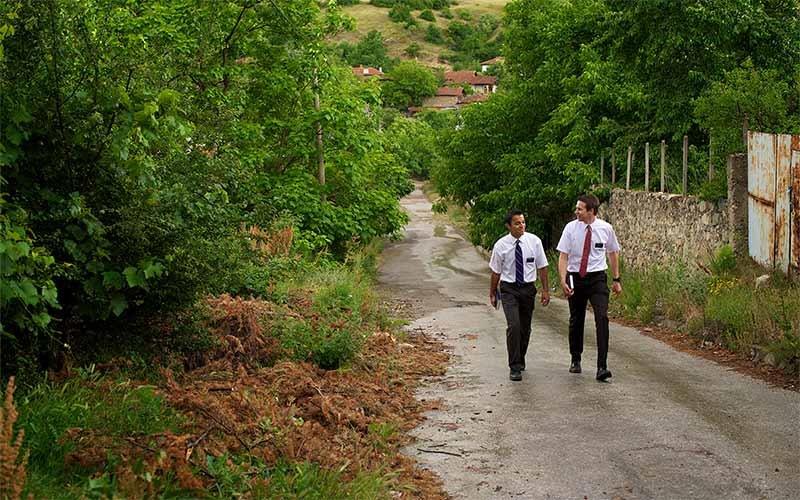 Elders walking along a path.