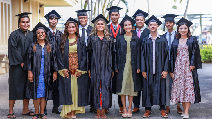 A group of BYU-Hawaii graduates in the caps and gowns