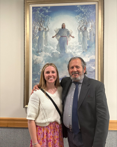 Sister Rasband and Tino after her mission smiling. 