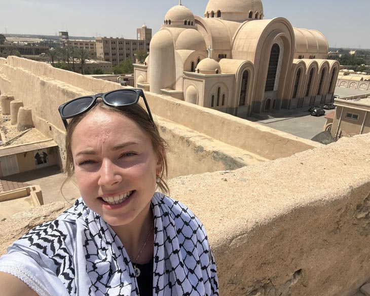 BYU student Madeline Swapp in front of a Church during her research trip to Egypt