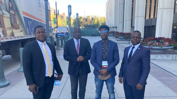 Ozzie and three other men in suits outside the Church Office Building in Salt Lake City