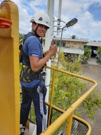 Winston working on a data communications tower. 