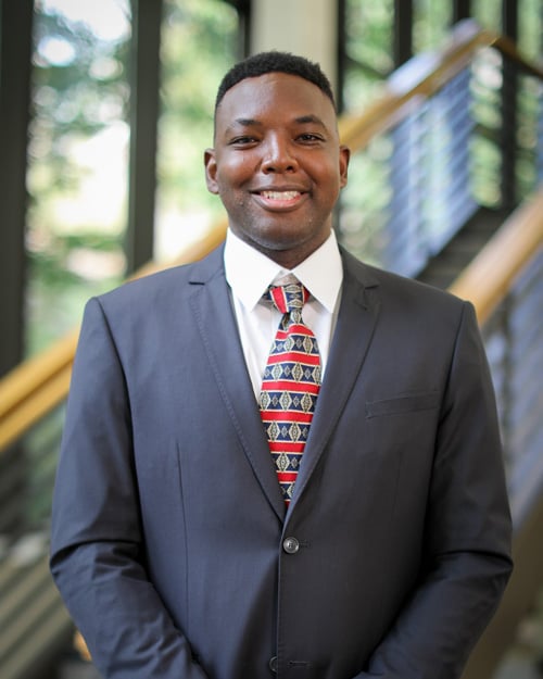 Paris Thomas, a former Ensign College student, smiling. 