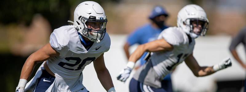 Two BYU football players at a team practice