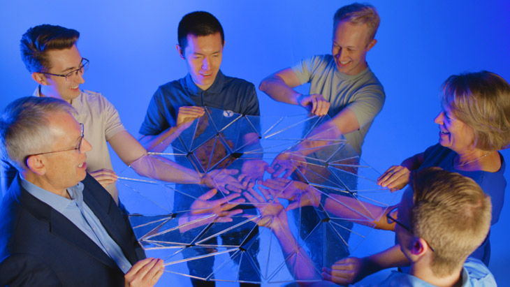 BYU students and professors with newly discovered blooming origami pattern