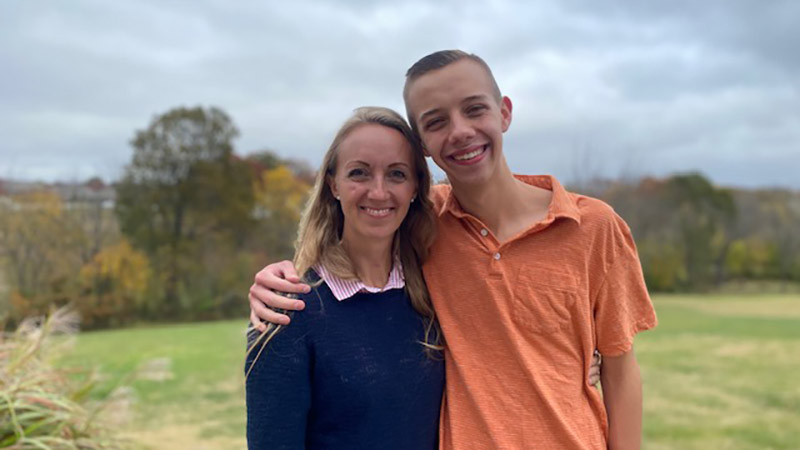 Elizabeth Hill and her son Gabriel pose outside for a photo