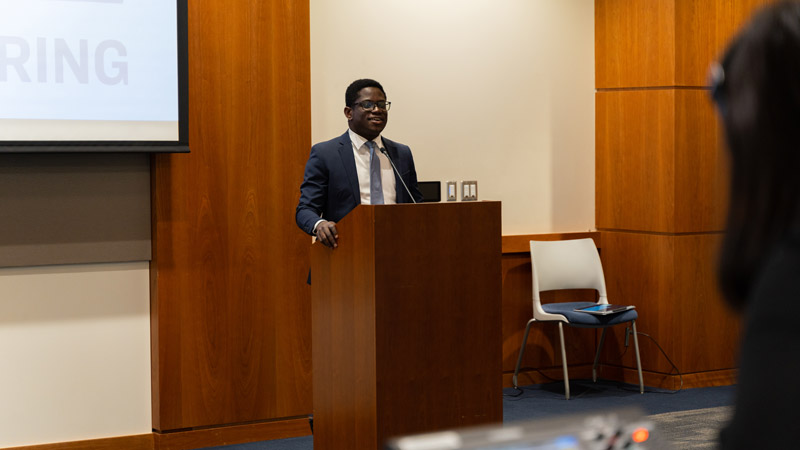 Photo of Daniel Yirenya-Tawiah speaking to a group of BYU donors