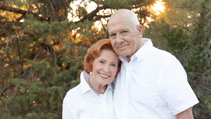 Lothaire and Chylee Bluth pose together outdoors for a photo