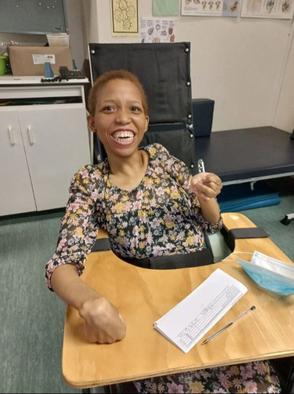 South African girl sitting in a custom wheelchair