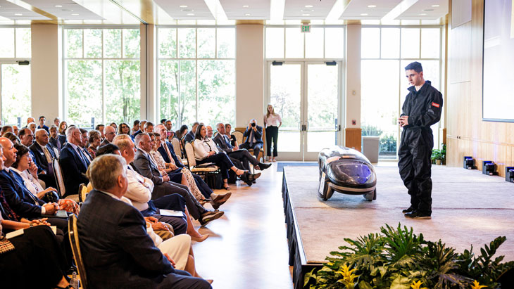 BYU student presenting engineering project car