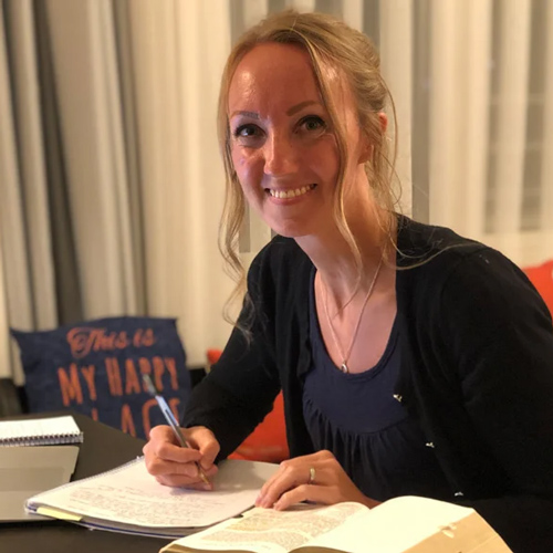 Woman studying for college classes in her home