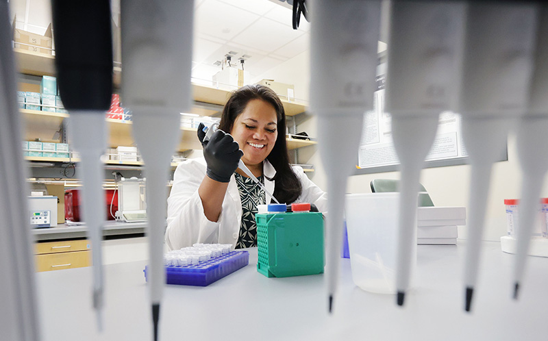 Student researcher working in lab