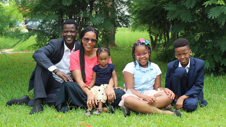 African family with a father, mother, and three children.