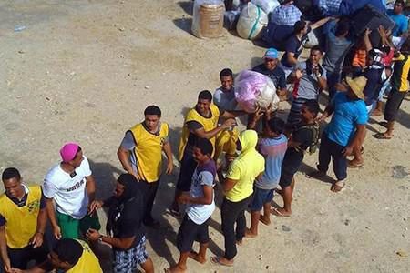 LDS Missionaries and other volunteers moving donated goods